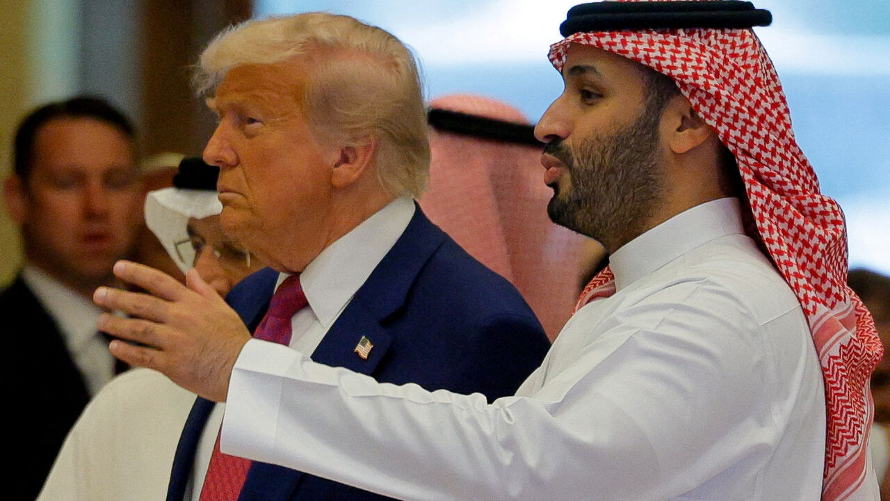 FILE PHOTO: Saudi Crown Prince Mohammed Bin Salman speaks with U.S. President Donald Trump on the day of the Saudi-U.S. Investment Forum, in Riyadh, Saudi Arabia, May 13, 2025. REUTERS/Brian Snyder/File Photo