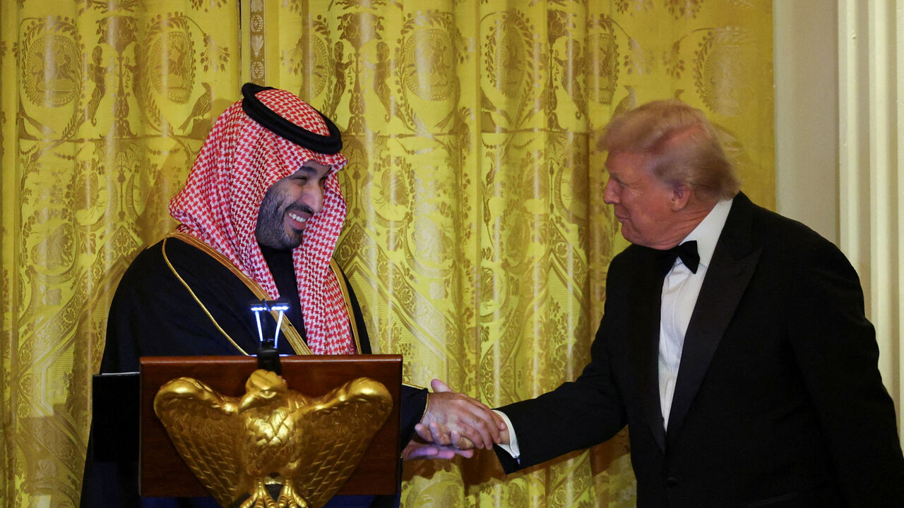 U.S. President Donald Trump greets Saudi Crown Prince and Prime Minister Mohammed bin Salman, during a dinner at the White House in Washington, D.C., U.S., November 18, 2025. REUTERS/Tom Brenner     TPX IMAGES OF THE DAY