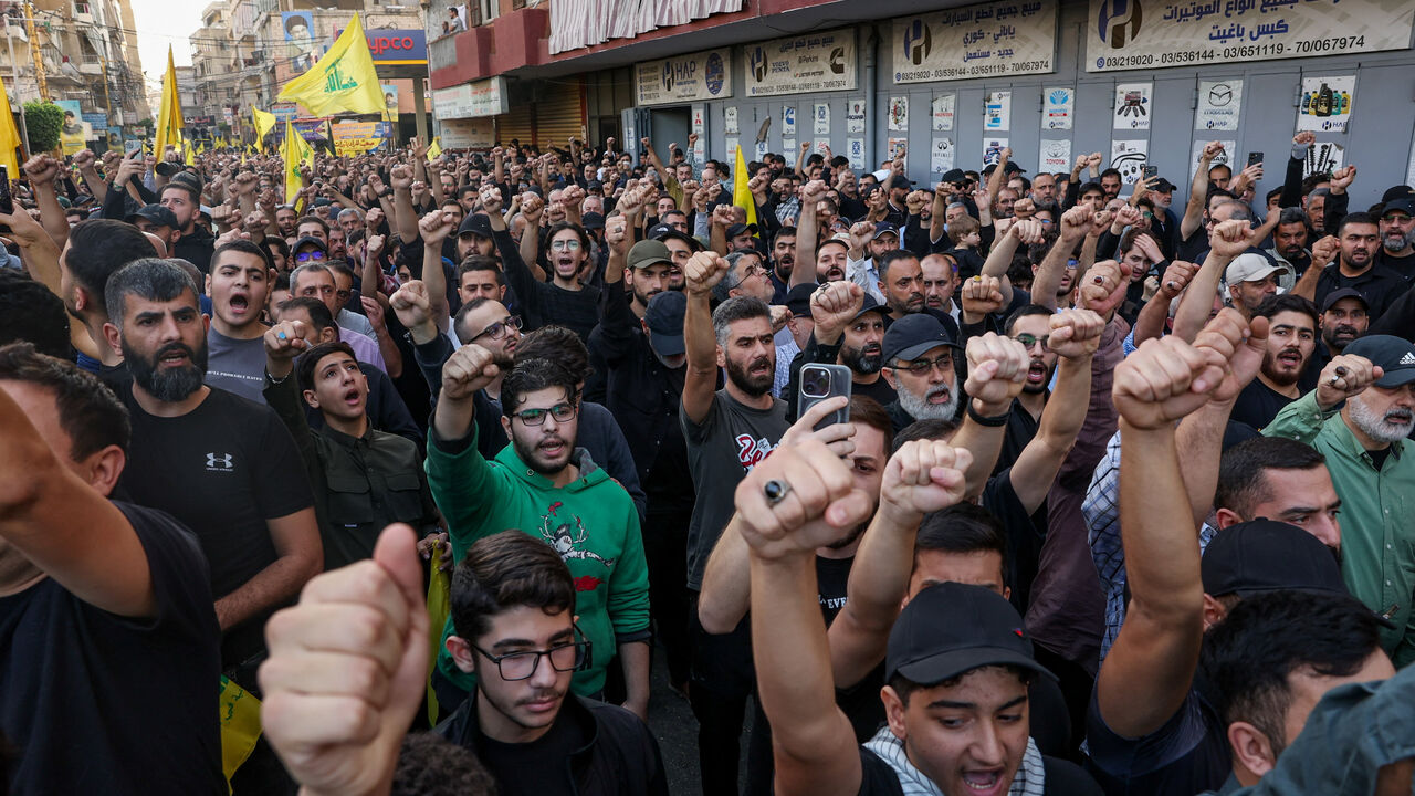 People attend the funeral of Hezbollah's top military official, Haytham Ali Tabtabai, and of other people who were killed by an Israeli airstrike on Sunday, despite a U.S.-brokered truce a year ago, in Beirut's southern suburbs, Lebanon November 24, 2025. REUTERS/Mohamed Azakir