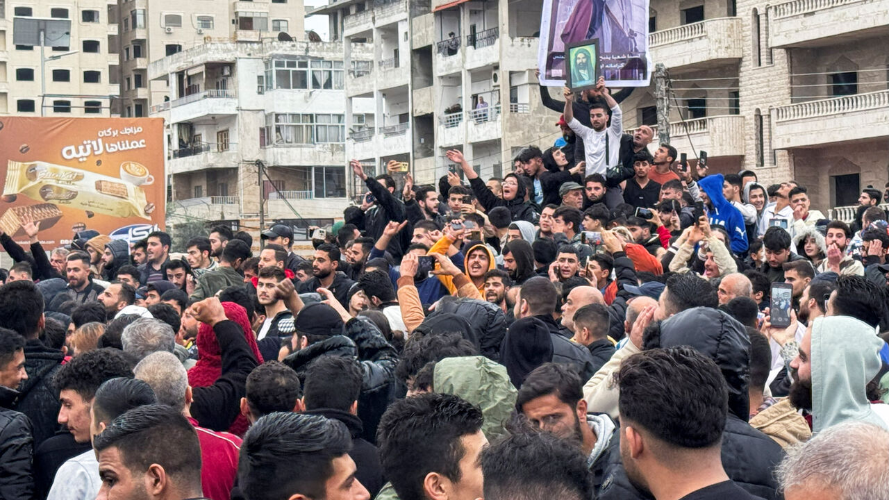Alawites gather during a protest to demand federalism and the release of detained members of their community, in Latakia, Syria November 25, 2025. REUTERS/Stringer