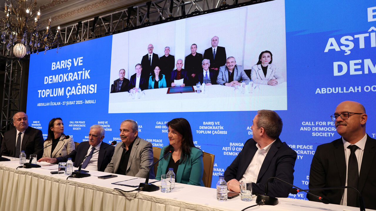 FILE PHOTO: Ahmet Turk, Pervin Buldan, Sirri Sureyya Onder, Tulay Hatimogullari, Tuncer Bakirhan, Cengiz Cicek and Faik Ozgur Erol, politicians and lawmakers from the pro-Kurdish Peoples' Equality and Democracy Party (DEM Party), with a picture take in Imrali Island prison with the jailed Kurdish militant leader Abdullah Ocalan, in the background, attend a press conference in Istanbul, Turkey, February 27, 2025. REUTERS/Umit Bektas/File Photo