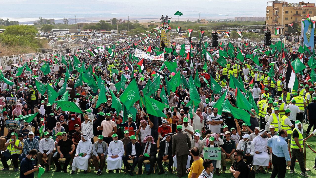 Supporters of Jordan's Muslim Brotherhood take part in a protest in the village of Sweimeh, near the Jordanian border with the occupied West Bank, on May 21, 2021.