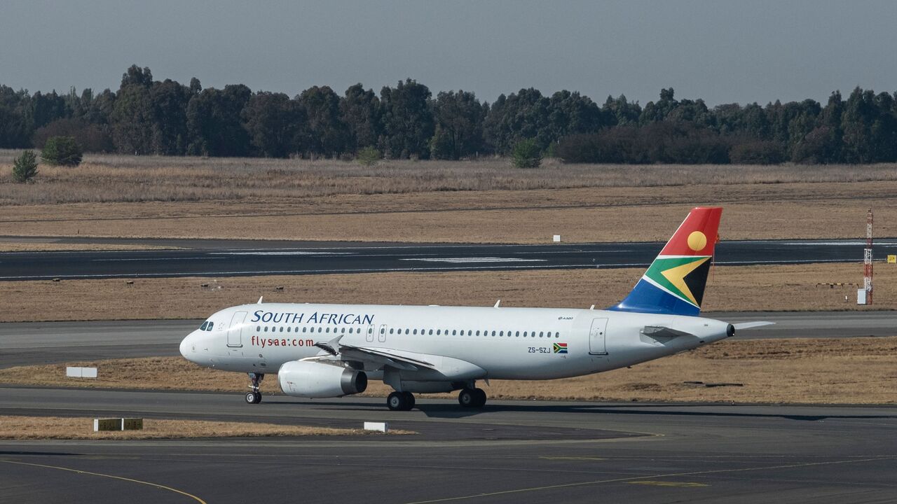 A South African Airways (SAA) flight is seen on the tarmac before departing from the O.R. Tambo International Airport in Johannesburg on Sept. 23, 2021. 