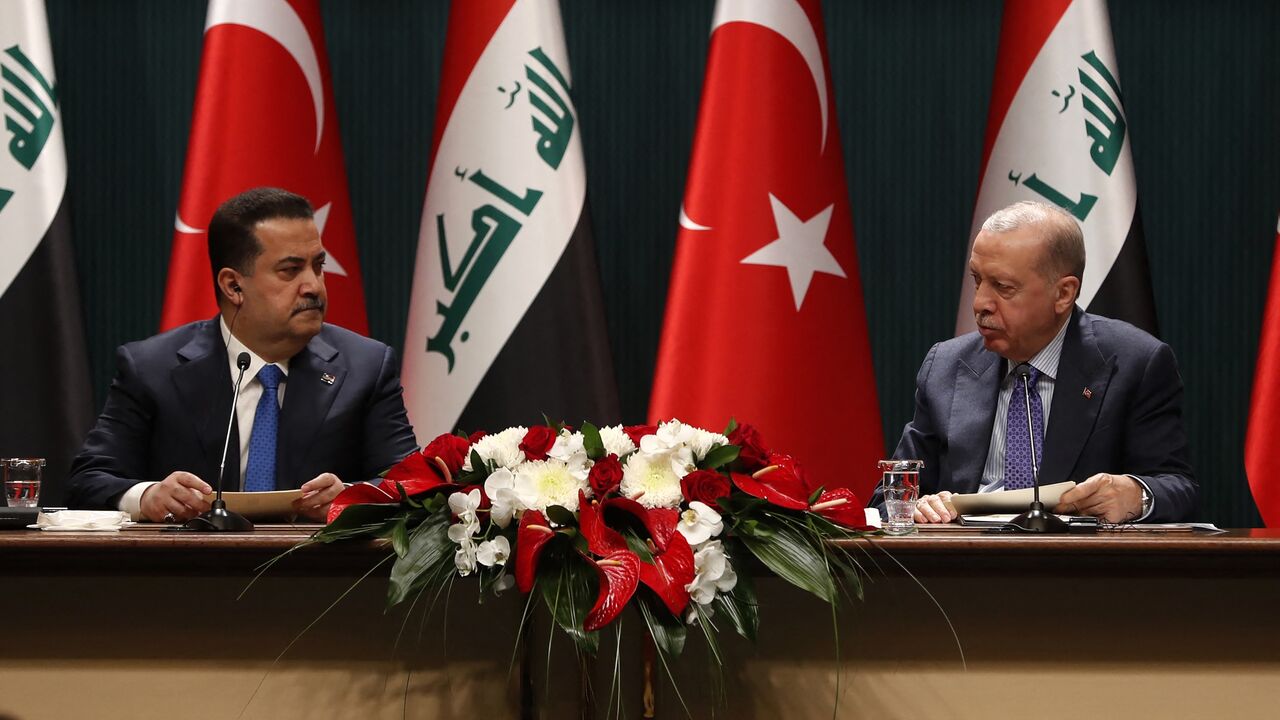 Turkish President Recep Tayyip Erdogan (R) and Iraq's prime minister, Mohammed Shia al-Sudani, during the signing ceremony of memorandums of understanding between Iraq and Turkey, in Ankara on May 8, 2025. 