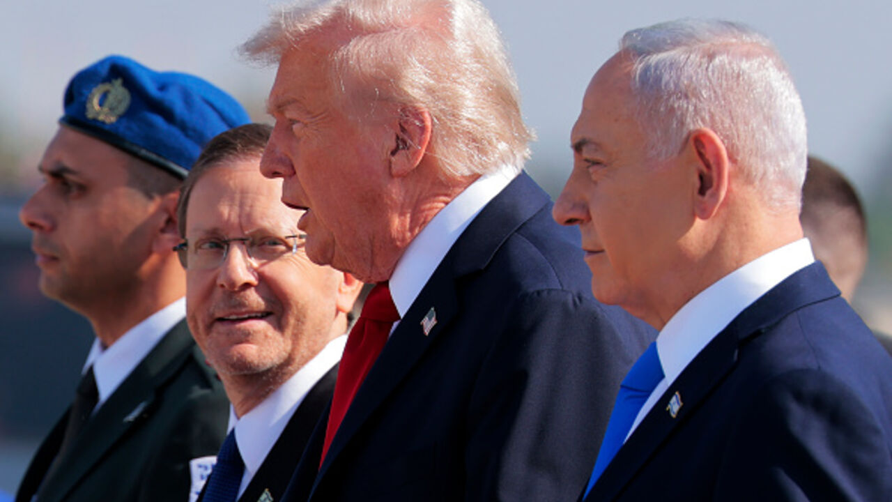 US President Donald Trump is welcomed by Israeli President Isaac Herzog and Prime Minister Benjamin Netanyahu at Ben Gurion International Airport on October 13, 2025 in Tel Aviv, Israel. (Chip Somodevilla/Getty Images)