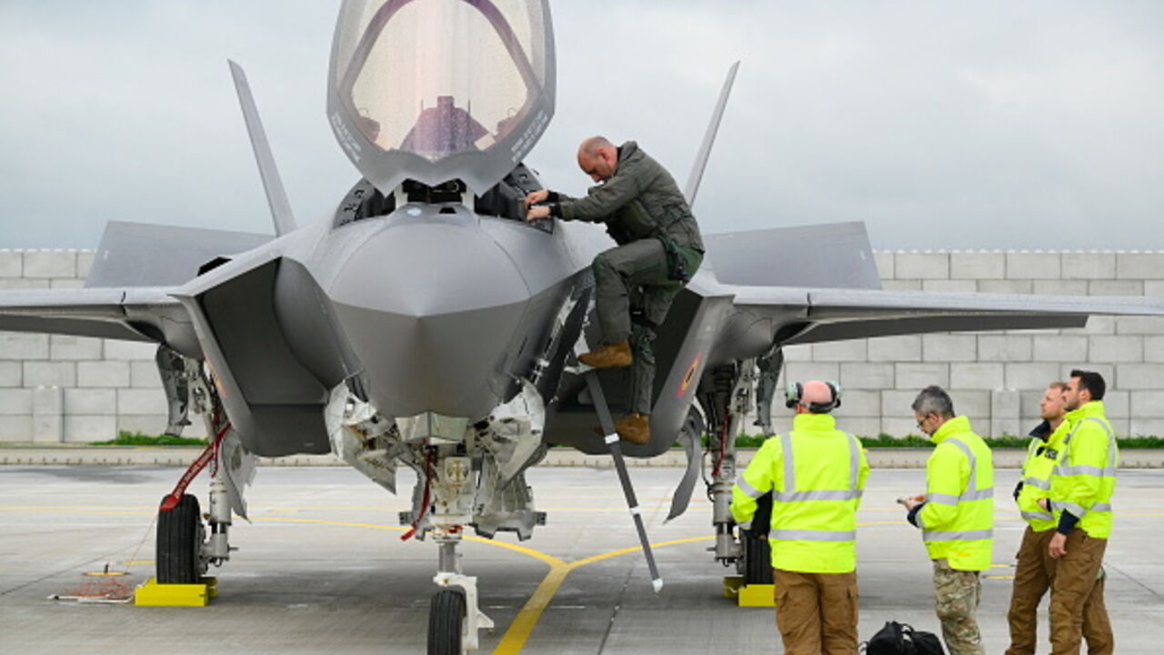 This photograph shows a pilot disembarking a Belgium's newly purchased Lockheed Martin F-35 Lightning II fighter jet for the first time, after arriving at the Florennes military airbase, southern Belgium on October 13, 2025. (Photo by JOHN THYS / AFP) (Photo by JOHN THYS/AFP via Getty Images)