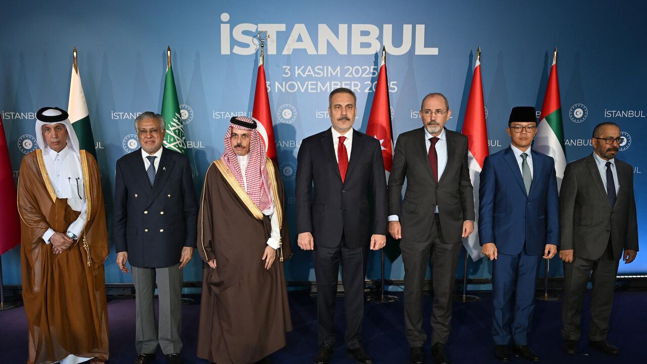 pose for a family photo during a meeting of foreign ministers from Muslim countries to discuss the Gaza peace plan, in Istanbul, on Nov. 3, 2025. 