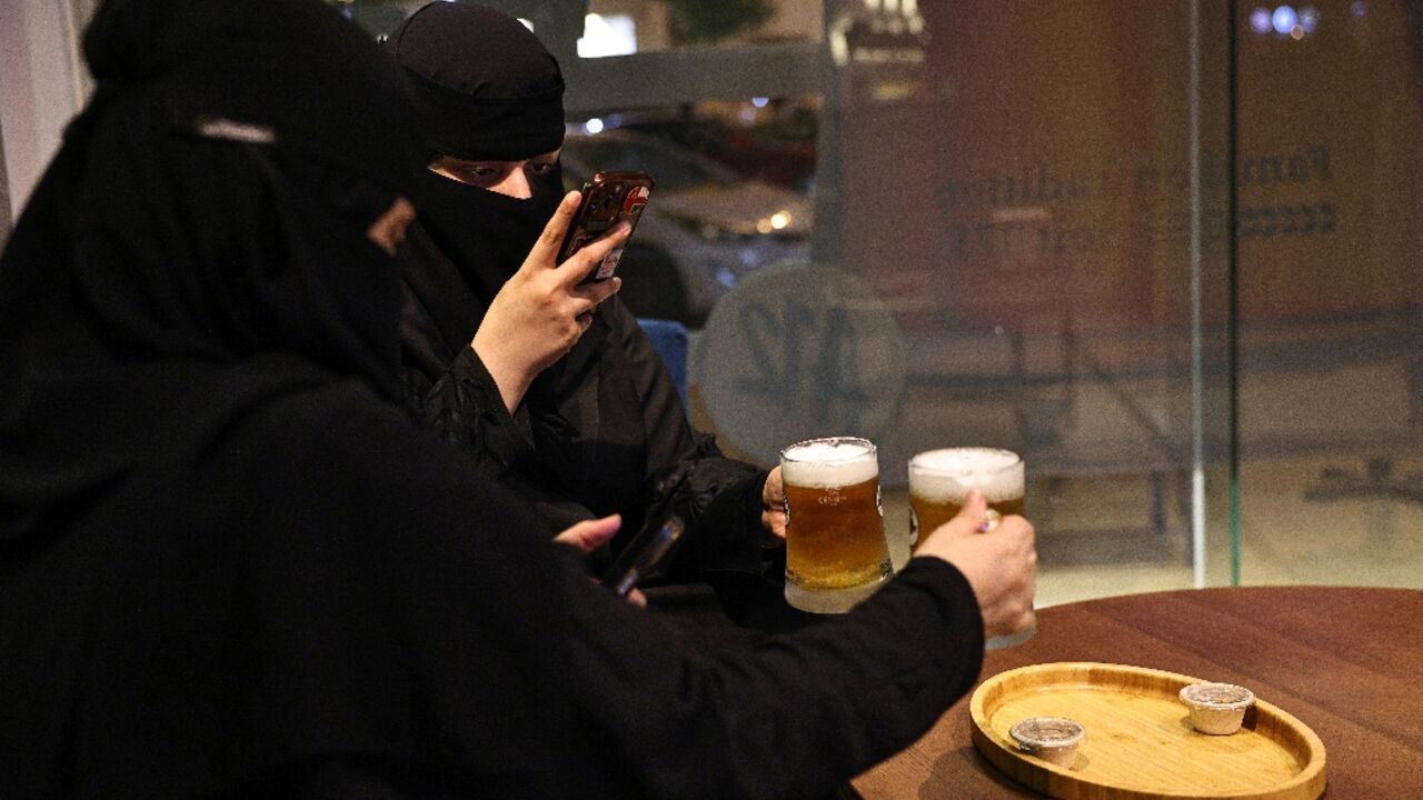 Saudi women enjoy alcohol-free draft beer at the A12 cafe in Riyadh