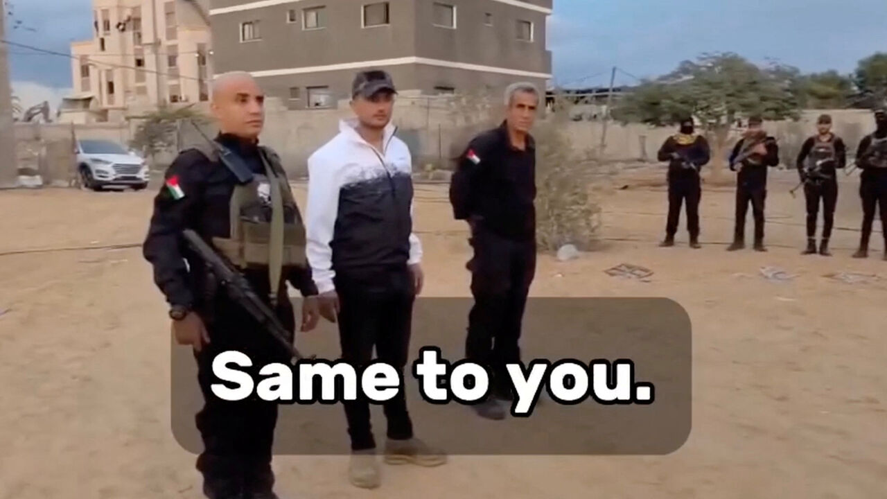 Leader of the Popular Forces Yasser Abu Shabab and his deputy Ghassan Al-Duhaini stand next to armed men in Rafah, in the southern Gaza Strip, in this screenshot taken from a video released on November 18, 2025. Yasser Abu Shabab/Popular Forces via REUTERS