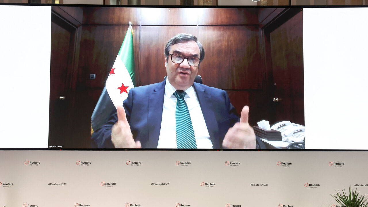 Abdul Kader AlHussrieh, Governor, Central Bank of Syria speaks via video link during the Reuters NEXT conference in New York City, U.S., December 4, 2025.  REUTERS/Brendan McDermid