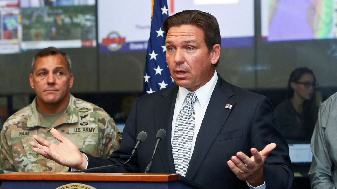 FILE PHOTO: Florida Governor Ron DeSantis speaks about Hurricane Helene as Adjutant General of Florida Major General John Haas looks on during a press briefing at the Emergency Operations Center in Tallahassee, Florida, U.S., September 26, 2024.   REUTERS/Phil Sears/File Photo