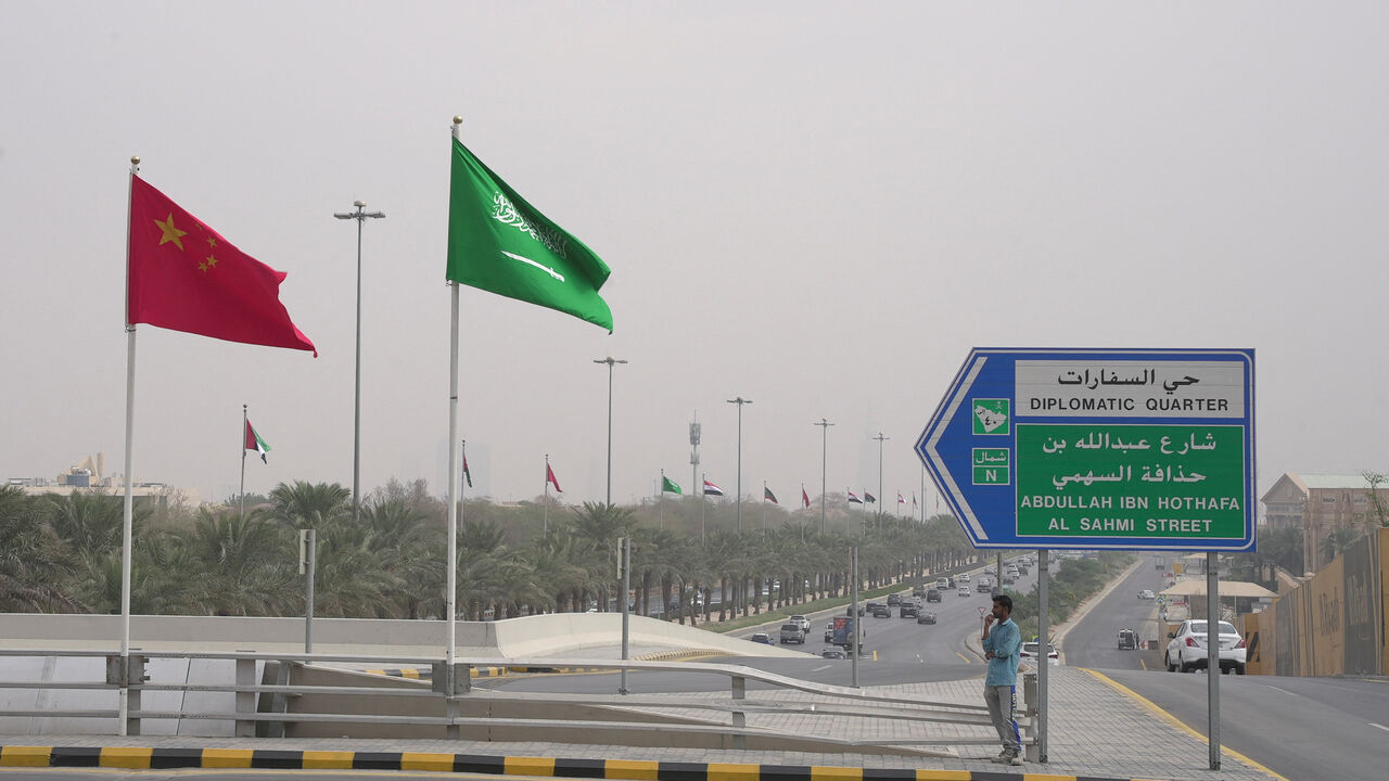 Flags of China and Saudi Arabia are seen in this picture, in Riyadh, Saudi Arabia, December 7, 2022. REUTERS/Mohammed Benmansour