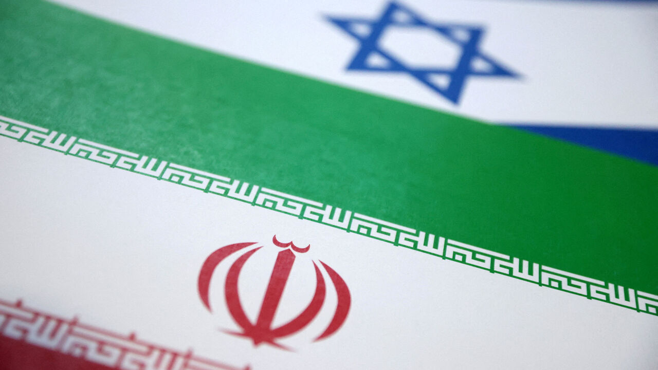 FILE PHOTO: Israel and Iran flags are seen in this illustration taken June 18, 2025. REUTERS/Dado Ruvic/Illustration/File Photo