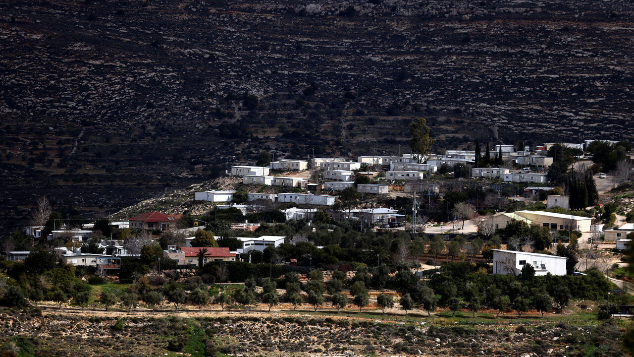 A view shows homes in the Jewish settlement of Givat Harel, taken from the Jewish settlement of Givat Haroeh in the Israeli-occupied West Bank, February 21, 2023. REUTERS/Ronen Zvulun