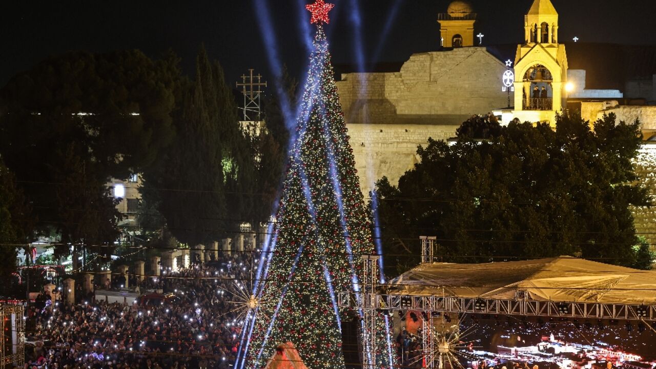 People packed the square in Bethlehem to watch the tree lit up during a two-hour ceremony, metres away from the Church of the Nativity