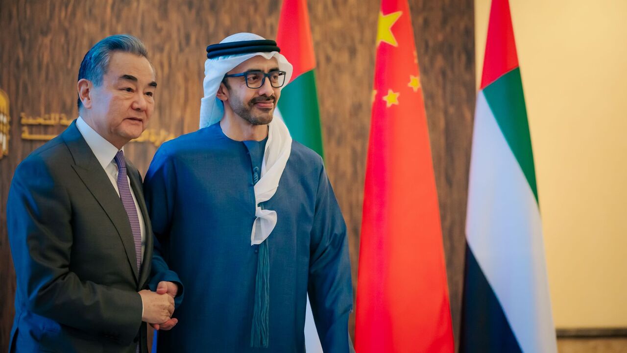 Chinese Foreign Minister Wang Yi (L) and Emirati Foreign Minister Sheikh Abdullah bin Zayed Al Nahyan (R) during a meeting on Dec. 12 in Abu Dhabi.