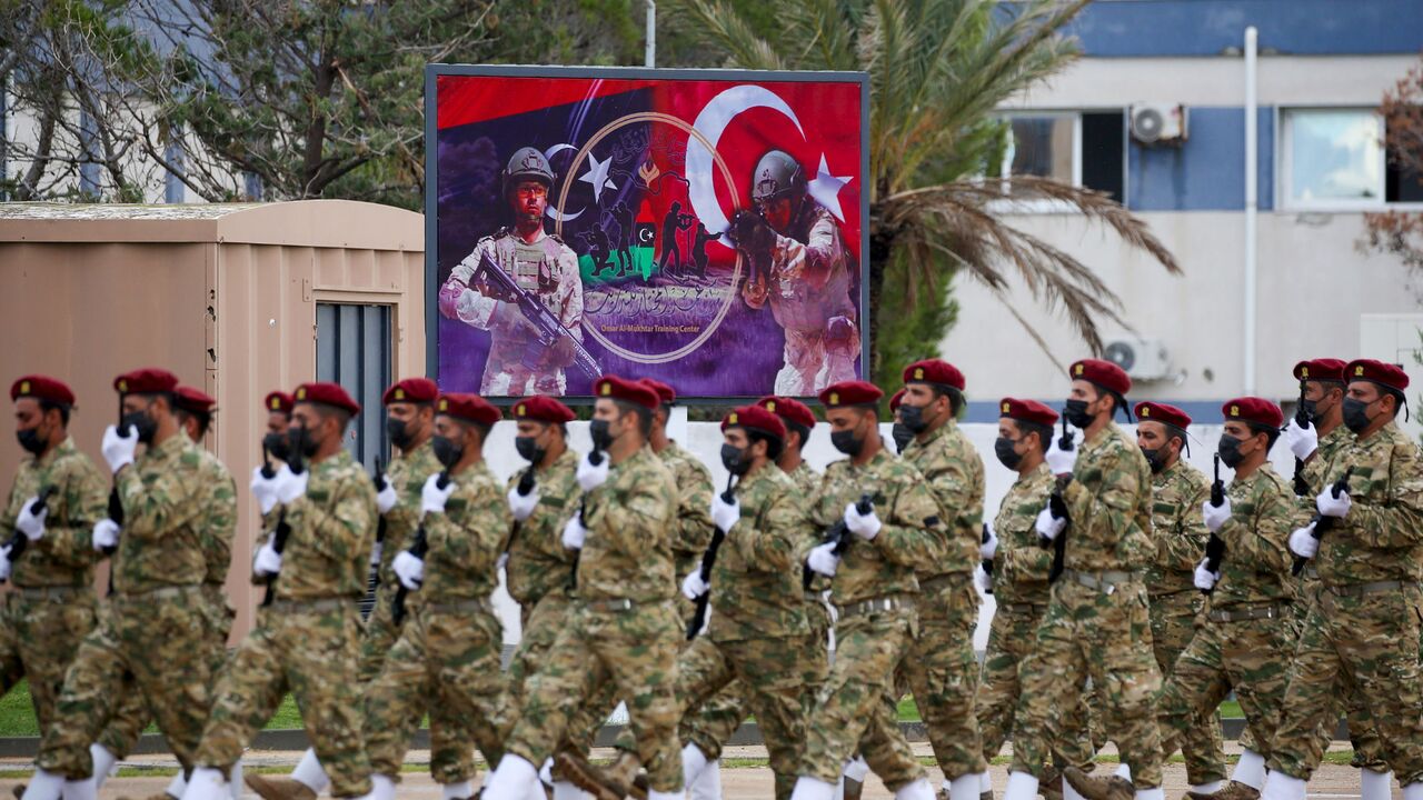 Libyan military graduates loyal to the UN-recognised Government of National Accord (GNA) take part in a parade marking their graduation, a result of a military training agreement with Turkey, at the Omar Mukhtar camp in the city of Tajoura, southeast of the capital Tripoli on November 21, 2020. (Photo by Mahmud TURKIA / AFP) (Photo by MAHMUD TURKIA/AFP via Getty Images)