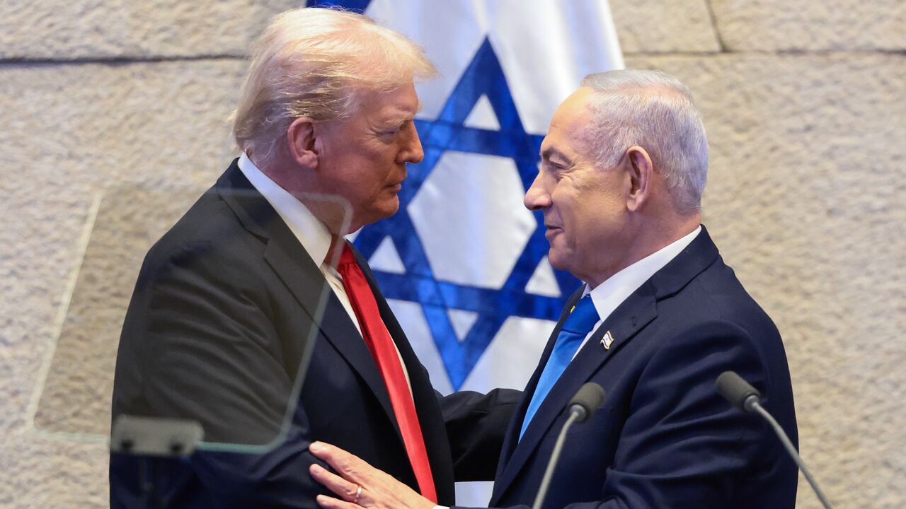 US President Donald Trump speaks with Israeli Prime Minister Benjamin Netanyahu at the Knesset, Israel's parliament, on Oct. 13, 2025, in Jerusalem. 