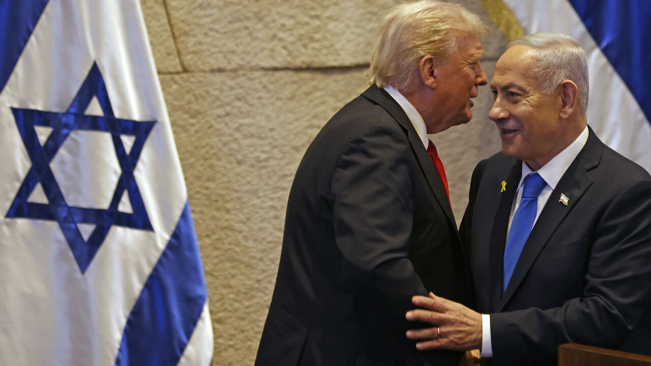President Donald Trump speaks with Israel's Prime Minister Benjamin Netanyahu in the Knesset, Israel's parliament, on Oct. 13, 2025 in Jerusalem.