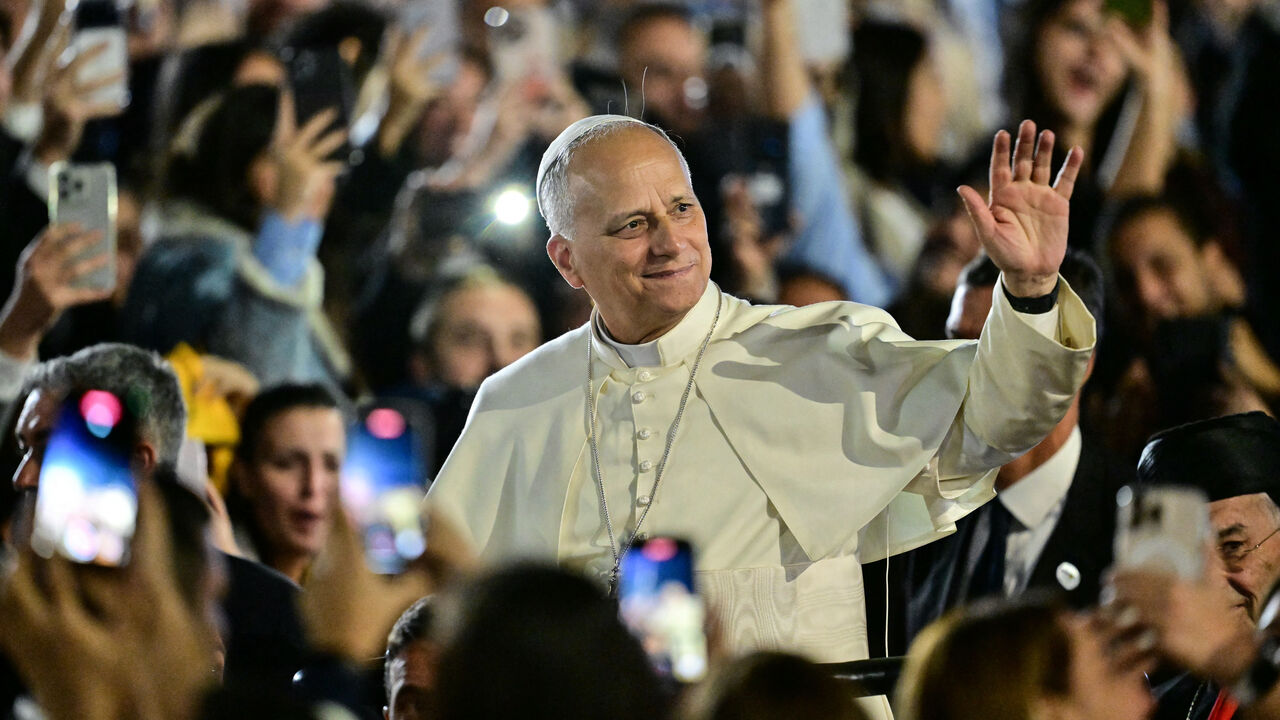 Pope Leo XIV waves to a crowd of youths upon his arrival at the Maronite Patriarchate in Bkerke, north of the capital Beirut, on December 1, 2025. Leo prayed for peace in Lebanon and the region on December 1 on day two of his trip to the multi-confessional country, with joyful Lebanese welcoming the pontiff at two famous pilgrimage sites. (Photo by Giuseppe CACACE / AFP via Getty Images)