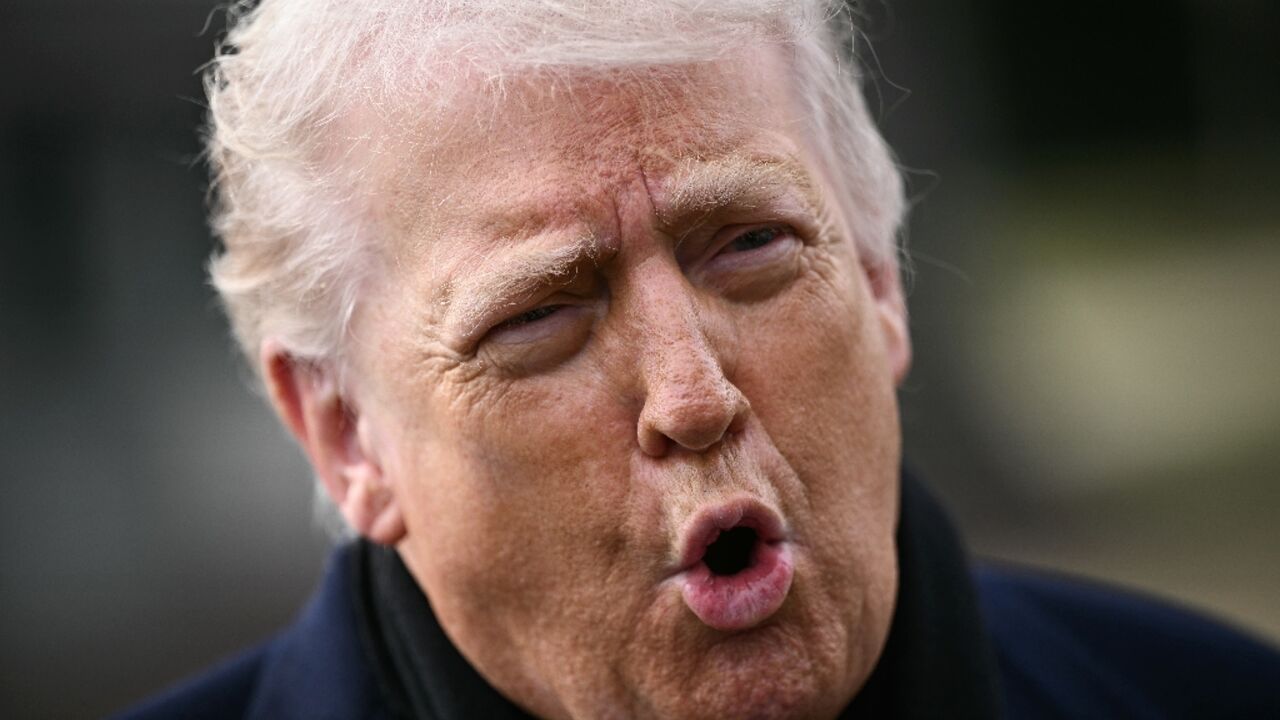 US President Donald Trump speaks to the press before boarding Marine One as he departs from the South Lawn of the White House in Washington