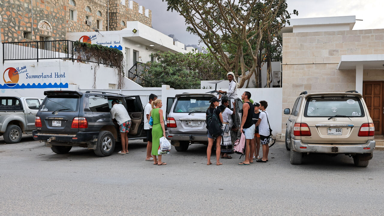 Tourists stand outside a hotel in the Socotra Island, Yemen, January 5, 2026. REUTERS/Stringer