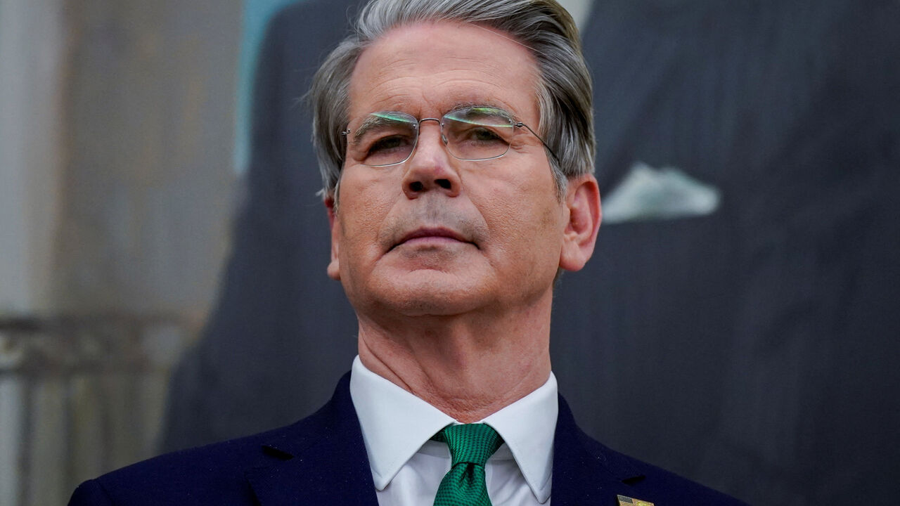U.S. Treasury Secretary Scott Bessent listens prior to U.S. President Donald Trump (not pictured) signing an executive order on AI in the Oval Office at the White House in Washington, D.C., U.S. December 11, 2025. REUTERS/Al Drago