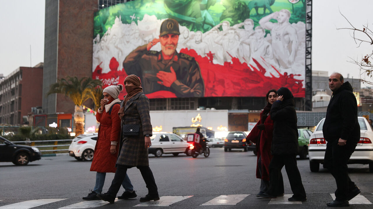 People walk on a street as protests erupt over the collapse of the currency's value in Tehran, Iran, January 2, 2026. Majid Asgaripour/WANA (West Asia News Agency) via REUTERS