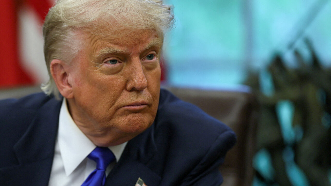 FILE PHOTO: U.S. President Donald Trump looks on as he signs executive orders and proclamations in the Oval Office at the White House, in Washington, D.C., U.S., May 5, 2025. REUTERS/Leah Millis/File Photo
