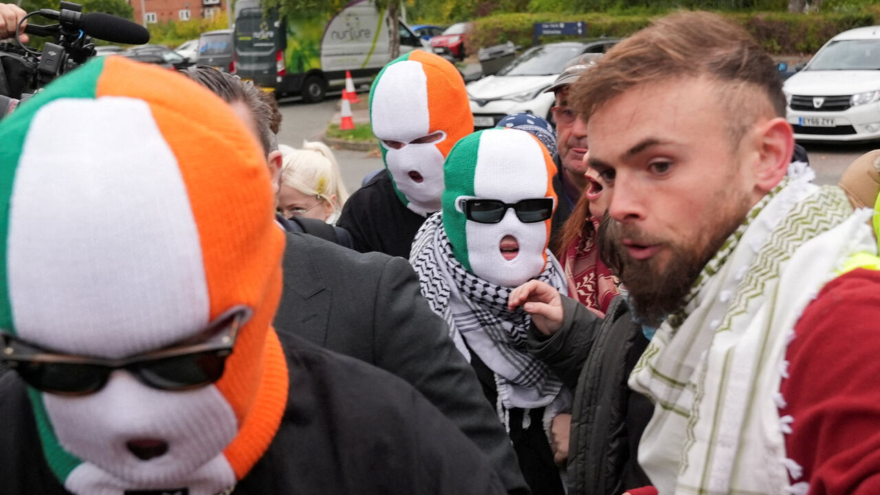 FILE PHOTO: Member of the rap group Kneecap, Liam O'Hanna, also known as Liam Og O hAnnaidh and performing under the name of Mo Chara, who has been charged with a terrorism offence in relation to the alleged display of a Hezbollah flag onstage in 2024, walks outside the Woolwich Crown Court on the day of a hearing, in London, Britain, September 26, 2025. REUTERS/Maja Smiejkowska/File Photo