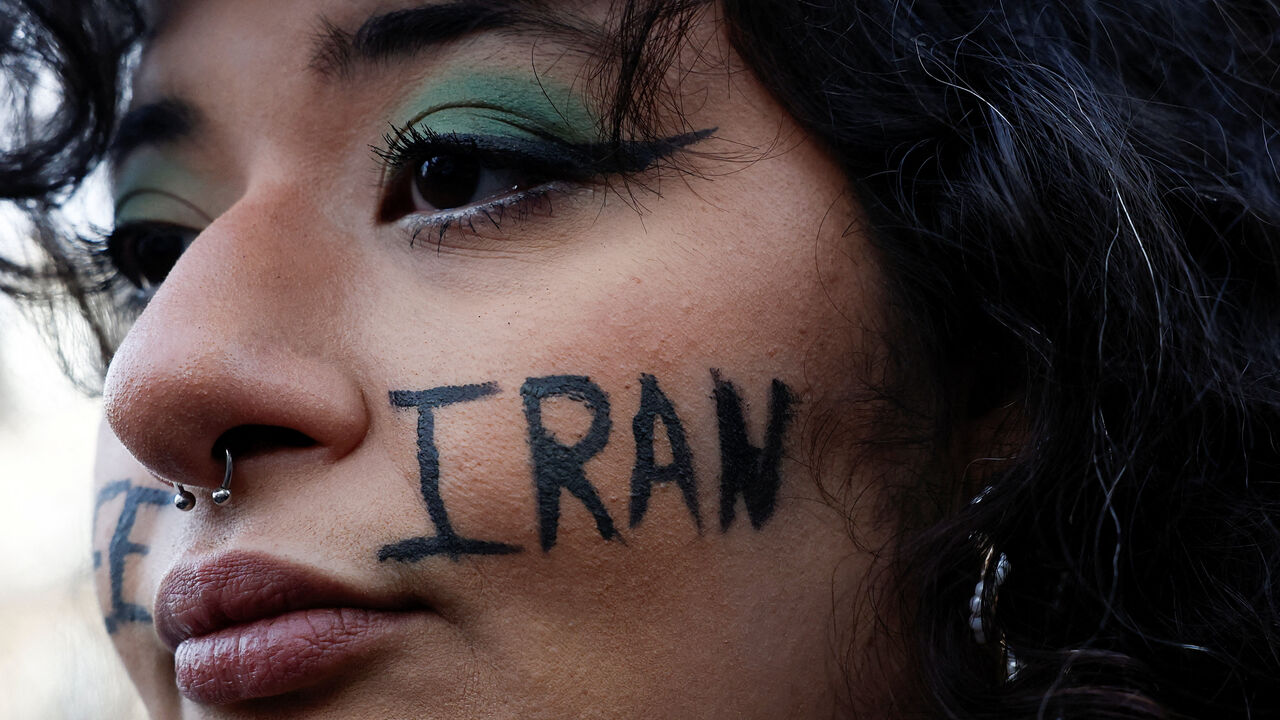 A demonstrator attends rally in support of Iranian people amid anti-government protests raging across Iran, in Paris, France, January 11. REUTERS/Benoit Tessier