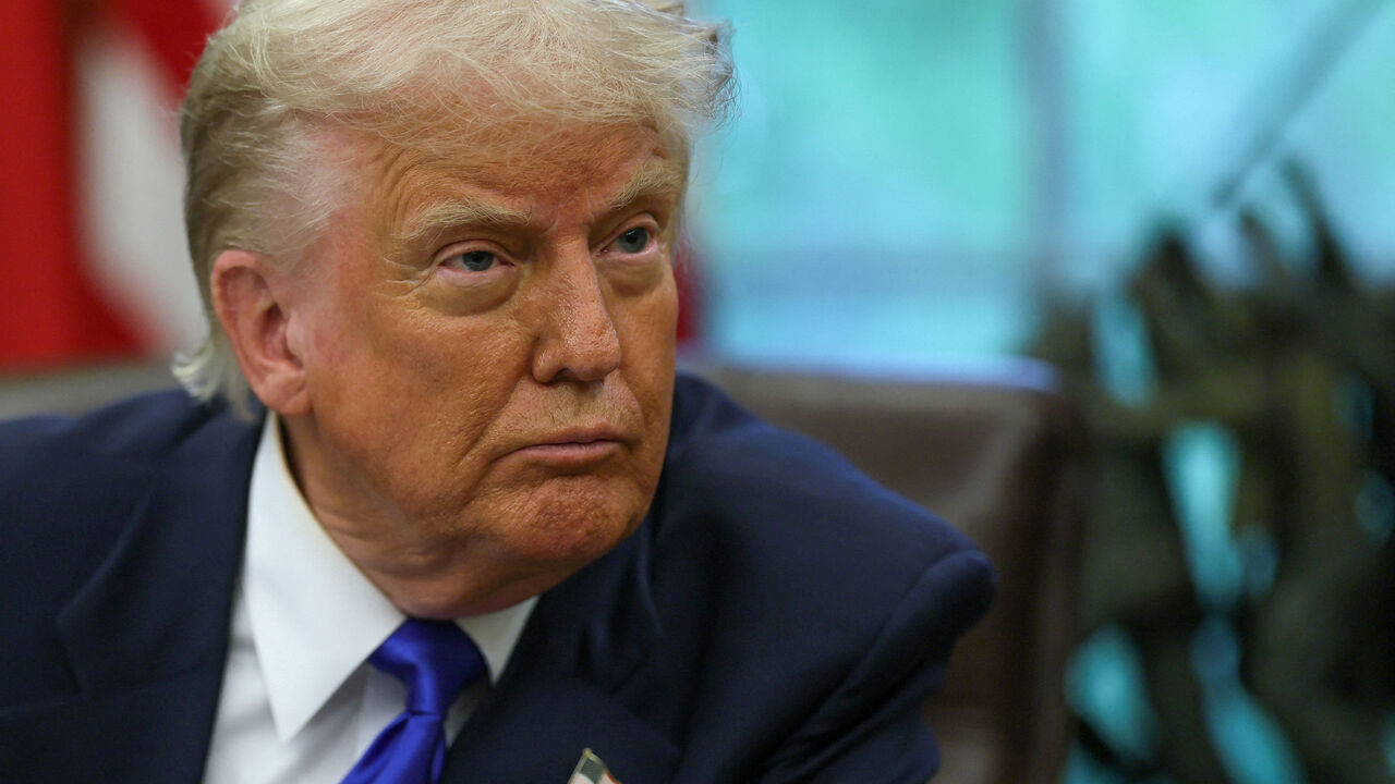 FILE PHOTO: U.S. President Donald Trump looks on as he signs executive orders and proclamations in the Oval Office at the White House, in Washington, D.C., U.S., May 5, 2025. REUTERS/Leah Millis/File Photo