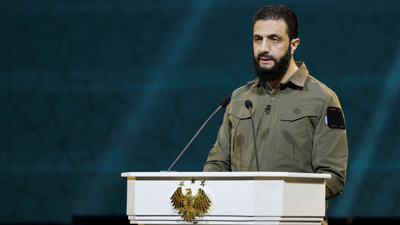 FILE PHOTO: Syria's President Ahmed al-Sharaa delivers a speech on the first anniversary of Bashar al-Assad's fall, in Damascus, Syria December 8, 2025. REUTERS/Khalil Ashawi/File Photo