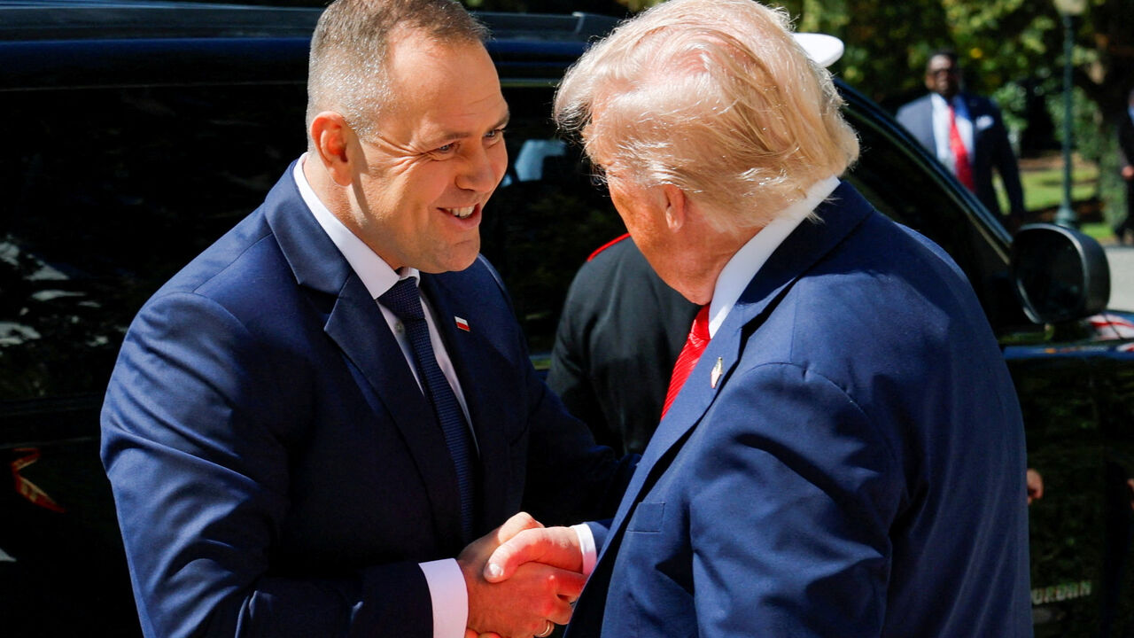 U.S. President Donald Trump greets the President of Poland Karol Nawrocki at the White House in Washington, D.C., U.S., September 3, 2025. REUTERS/Brian Snyder