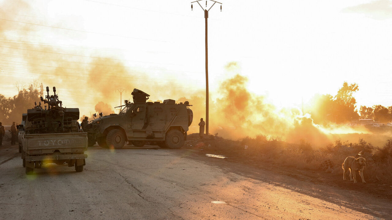 Military members gather near Raqqa prison, where the Syrian army is besieging SDF members after the Syrian army took control of the city of Raqqa, Syria January 19, 2026. REUTERS/Mahmoud Hassano