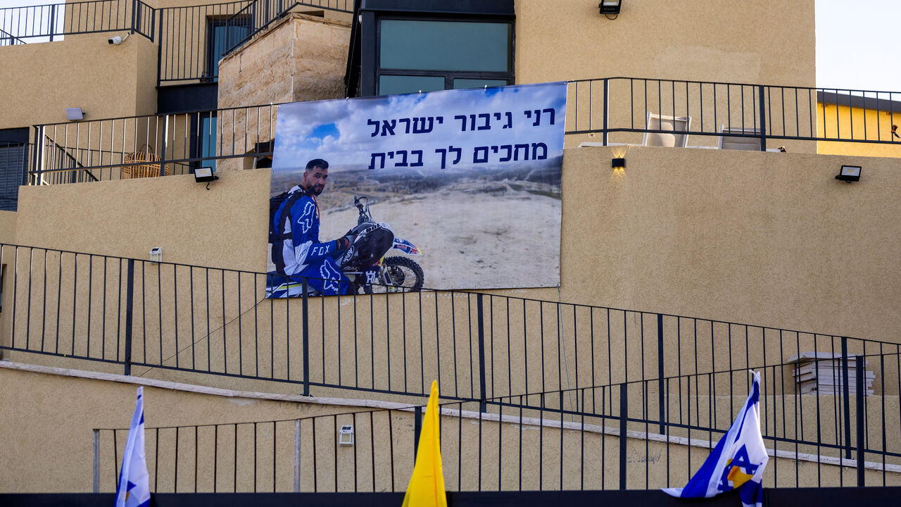 A sign depicting Ran Gvili, the last hostage remaining in Gaza following the deadly October 7, 2023 attack by Hamas. REUTERS/Ronen Zvulun