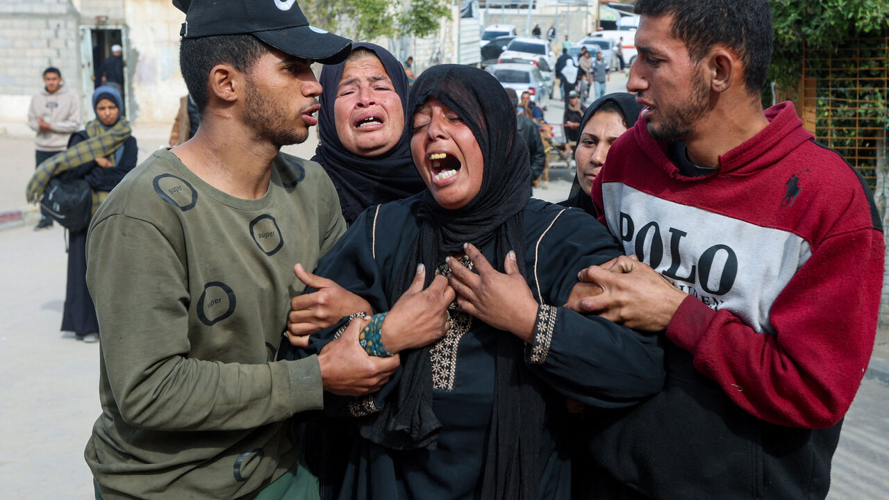 Mourners react during the funeral of Palestinians who, according to medics, were killed by Israeli gunfire on Thursday, at Nasser Hospital in Khan Younis, in the southern Gaza Strip, January 29, 2026. REUTERS/Ramadan Abed