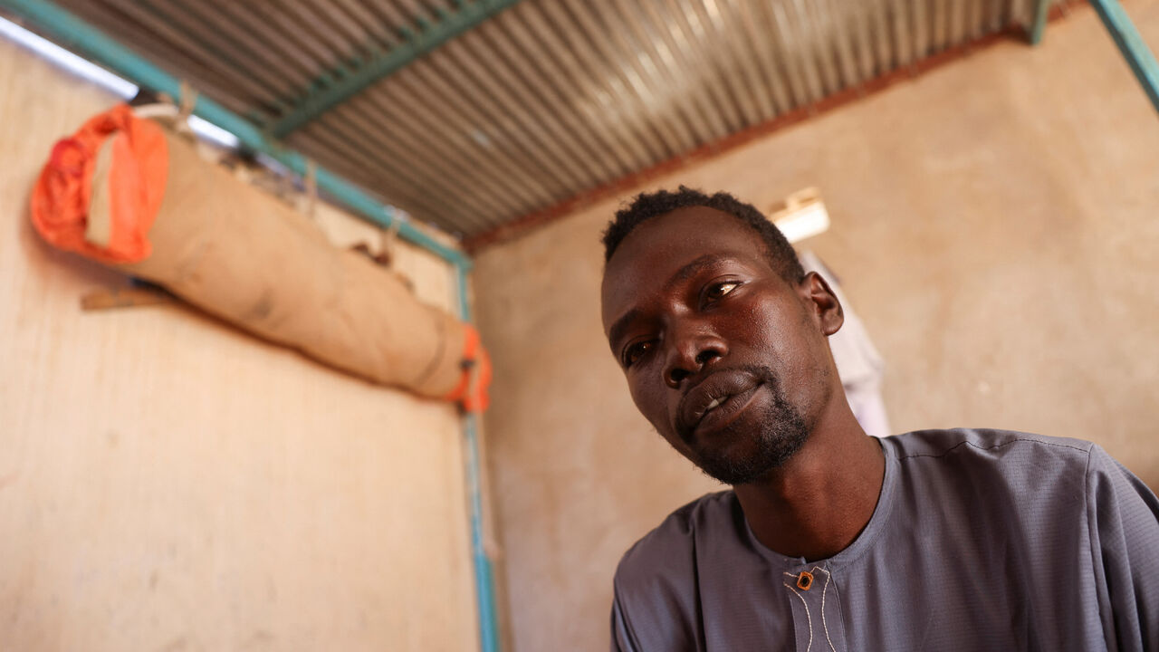 Abdulmajeed Abdulkarim, 28, a Sudanese refugee who heard small children crying at night for their parents while he was held captive by paramilitary Rapid Support Forces (RSF) fighters outside of al-Fashir, during an interview with Reuters in Tine, Chad November 24, 2025. REUTERS/Amr Abdallah Dalsh