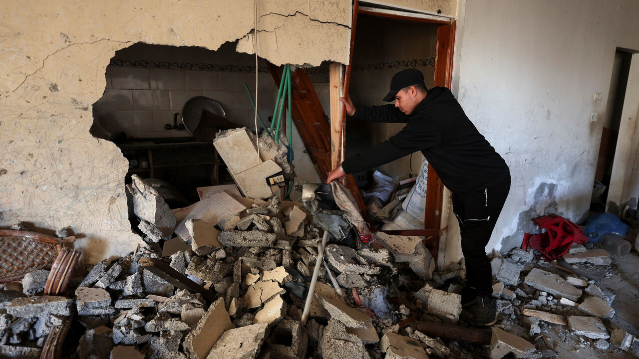 A Palestinian inspects the site of an Israeli strike on Saturday, in Gaza City, January 31, 2026. REUTERS/Dawoud Abu Alkas