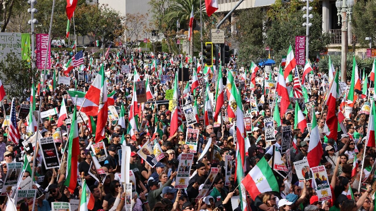 Protesters held flags and placards during a rally in solidarity with protesters in Iran in Los Angeles 