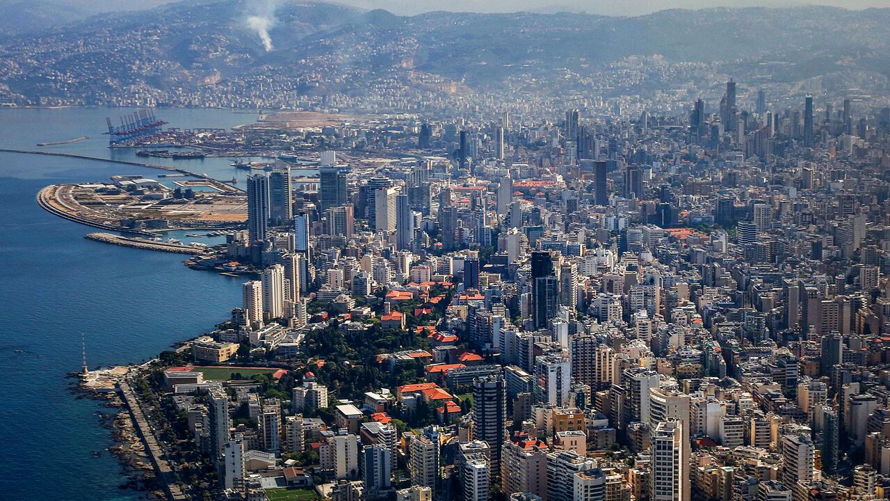 This aerial view taken from a Hellenic Air Force aircraft carrying medical aid supplies to Lebanon shows the skyline and port of Beirut during the landing approach towards Beirut International Airport on October 25, 2024. Israel expanded operations in Lebanon nearly a year after Hezbollah began exchanging fire in support of its ally, Hamas, following the Palestinian group's deadly attack on Israel on October 7, 2023. (Photo by ORESTIS PANAGIOTOU / POOL / AFP) (Photo by ORESTIS PANAGIOTOU/POOL/AFP via Getty 