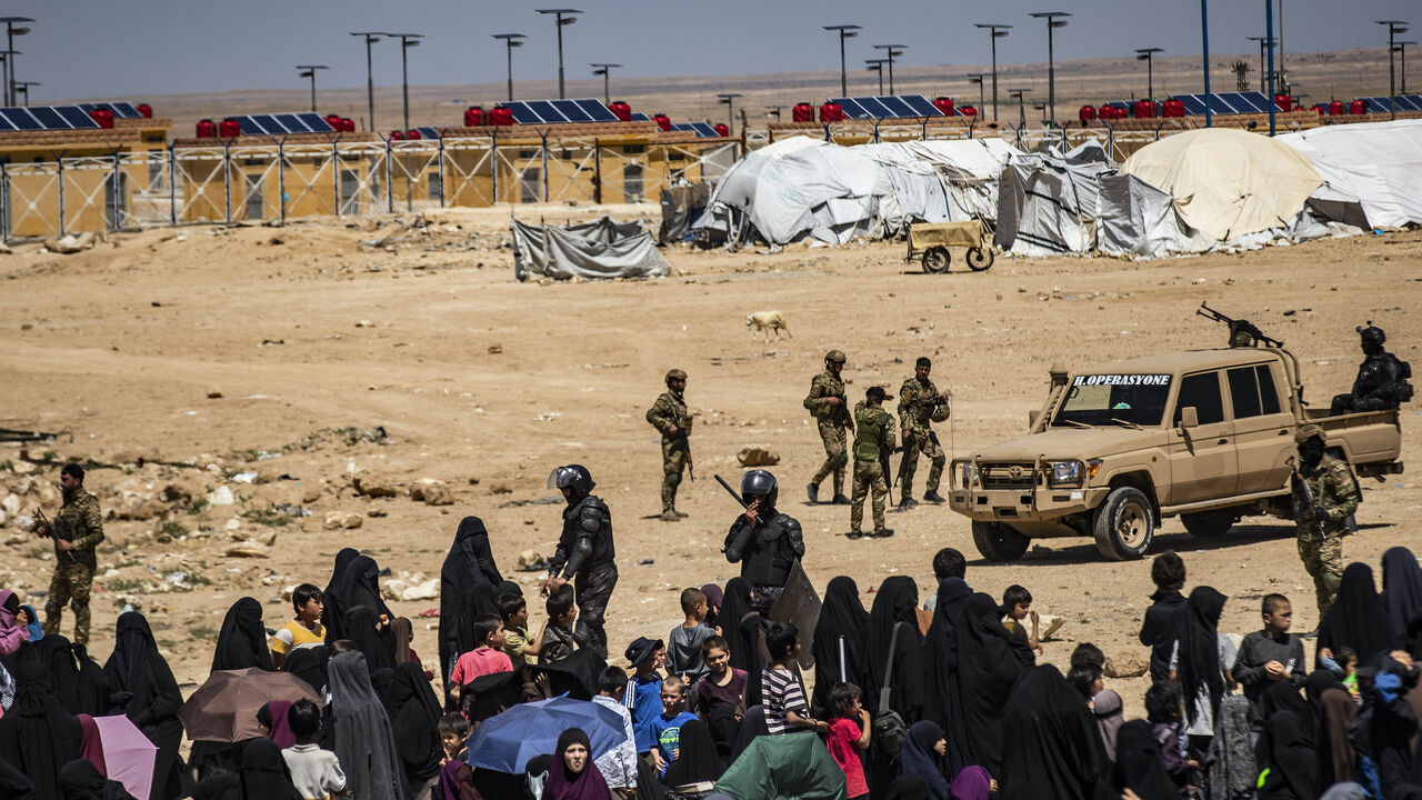 Members of the Syrian Kurdish Asayish security forces gather at the Kurdish-run al-Hol camp, which holds relatives of suspected Islamic State (IS) group fighters in the northeastern Hasakeh governorate, on April 18, 2025, as the Syrian Democratic Forces mount a security campaign against IS "sleeper cells" in the camp.