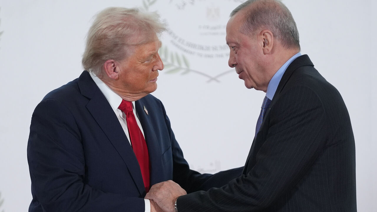 US President Donald Trump greets Turkey's President Recep Tayyip Erdogan during a world leaders' summit on ending the Gaza war on Oct. 13, 2025 in Sharm El-Sheikh, Egypt.  