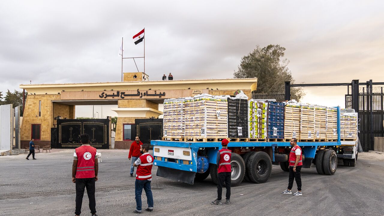 Truck carrying aid enters Gaza through the border crossing on Oct. 12, 2025, in Rafah, Egypt. 