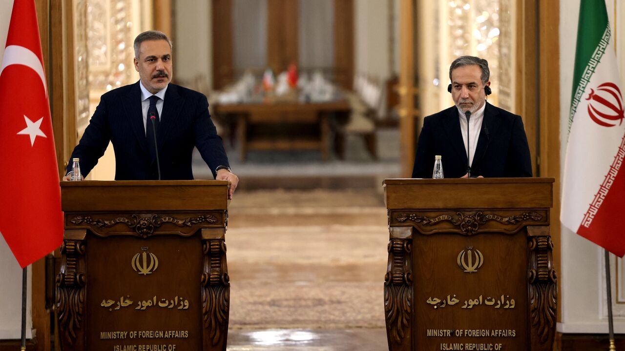 Turkey's Foreign Minister Hakan Fidan (L) and Iran's Foreign Minister Abbas Araghchi holds a joint press conference in Tehran, on Nov. 30, 2025.