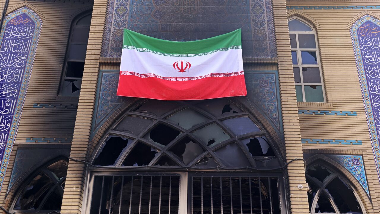 This photograph shows an Iranian national flag installed on the Beheshti Mosque that was damaged during recent public protests, in Tehran on Jan. 21, 2026. 