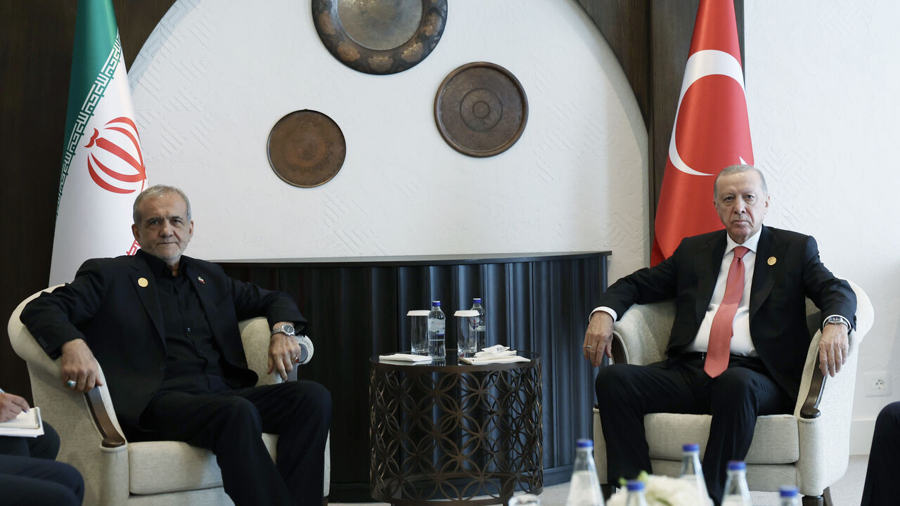 Turkish President Recep Tayyip Erdogan meets with Iranian President Masoud Pezeshkian as they attend the 17th Summit of the Economic Cooperation Organization in Khankendi, Azerbaijan on July 4, 2025.