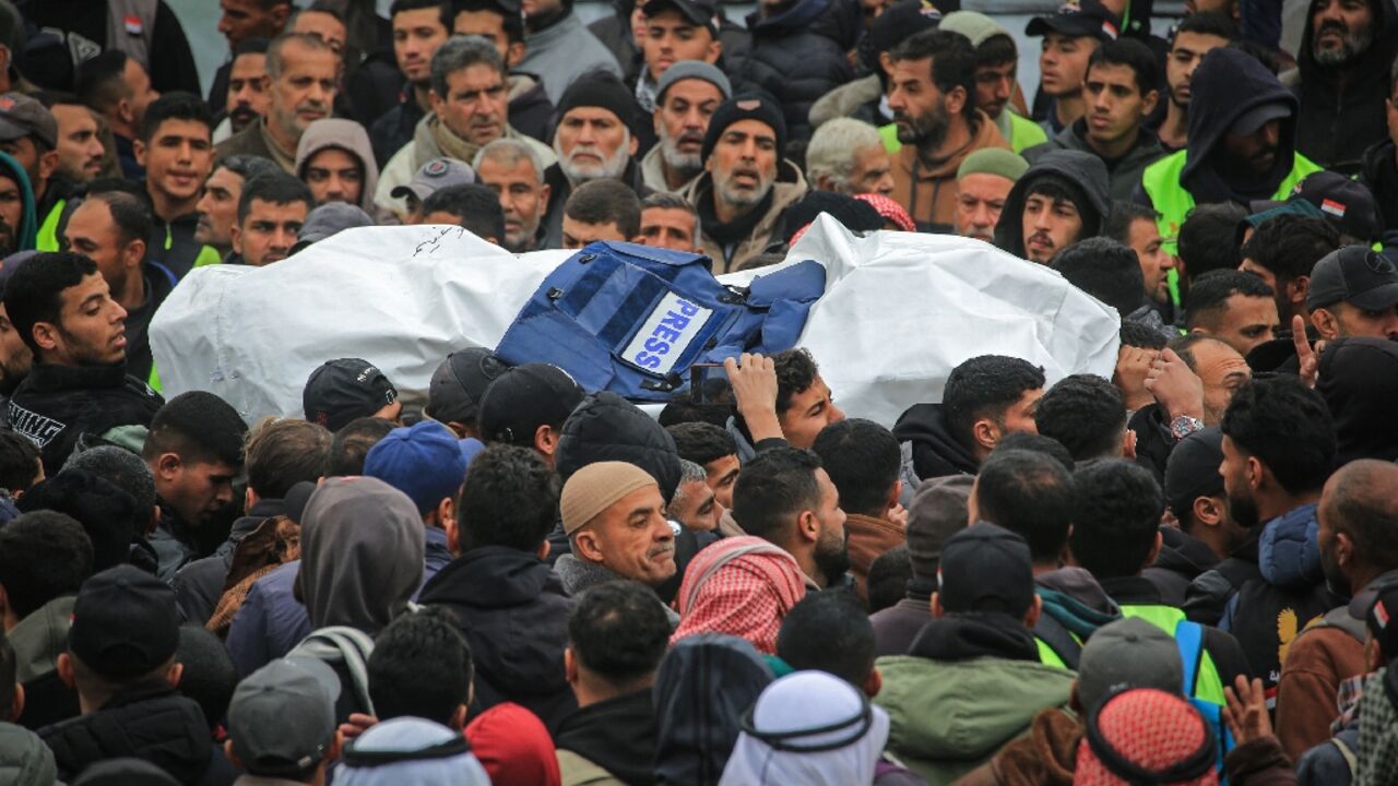 Hundreds crowded into the grounds of Nasser Hospital in Khan Yunis in Gaza to pay tribute to three fallen colleagues