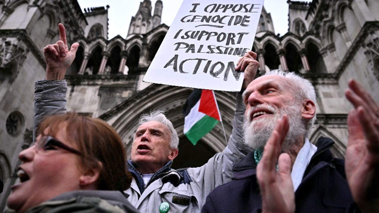 Protestors cheer after the High Court in London rules that a UK ban on the Palestine Action group interfered with the right to freedom of speech