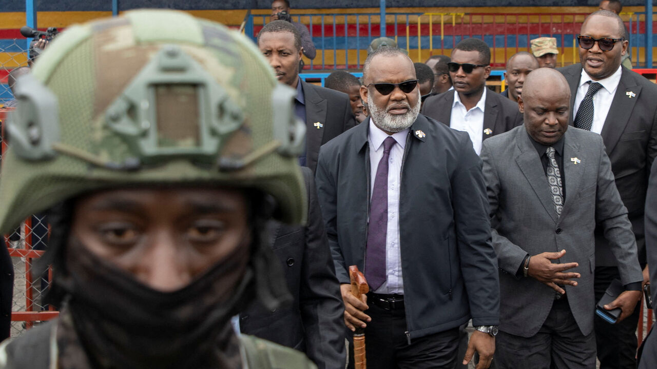 Corneille Nangaa, coordinator of the Alliance Fleuve Congo AFC/M23, arrives at Unity Stadium with rebel leaders for a funeral ceremony for victims who died in a drone strike in Masisi territory, in Goma, North Kivu province, Democratic Republic of Congo, January 8, 2026. REUTERS/Arlette Bashizi